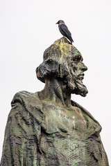 Fototapeta premium Prague, Czech republic - March 19, 2020. Statue of Mistr Jan Hus in empty Old Town Square during coronavirus crisis