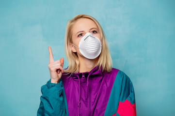 Blonde woman in face mask and 90s style clothes