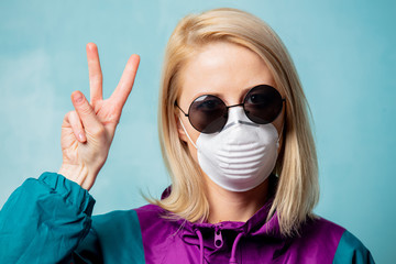 Blonde woman in face mask and 90s style clothes