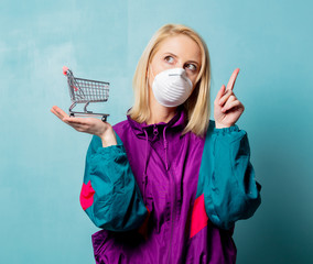 woman in 90s clothes and face mask with shopping cart