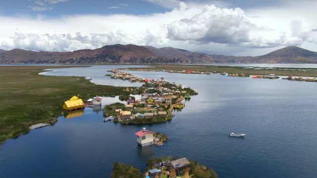 Aerial view of Uros Floating Islands (Spanish: Islas Uros ) on Lake Titicaca, the highest navigable lake in the world, near Puno, Peru, South America.