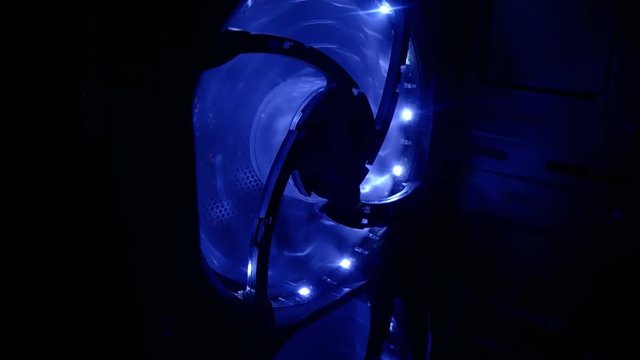 Cooling fans illuminated by internal LEDs inside a server computer.