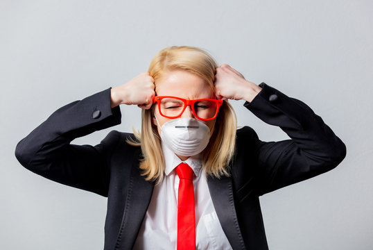 Businesswoman in face mask and red glasses