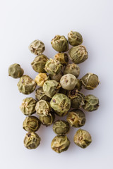 spicy green peppers on white acrylic background