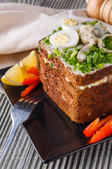a huge herring sandwich with mayonnaise and quail eggs