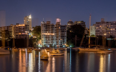 Fototapeta na wymiar yachts and apartments at night