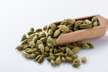 fragrant green cardamom on a white acrylic background