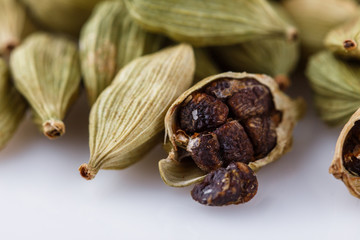 fragrant green cardamom on a white acrylic background