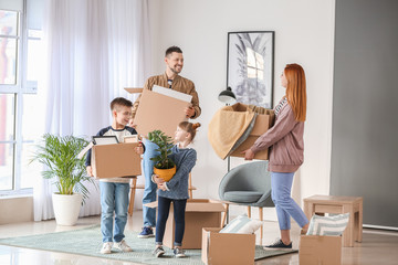 Family with moving boxes in their new house