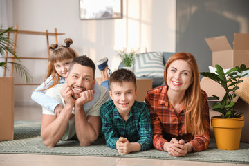 Family resting after moving to their new house