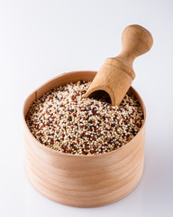 mix of quinoa grains on white acrylic background