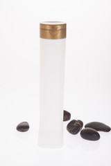 White multi purpose plastic container with gold lid.