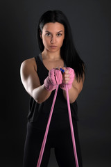 sexy girl training in the gym engaged in boxing