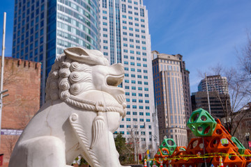 Boston, MA/USA -March 21, 2020: Coronavirus epidemic in China Town City of Boston. Big white statue of Chinese white dragon The Sculpture of the Dragon on the Street Chinese Totem © Julia