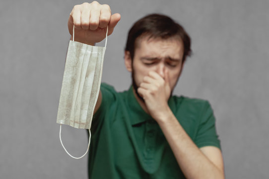 A Man Refuses To Wear A Medical Mask And Sneezes