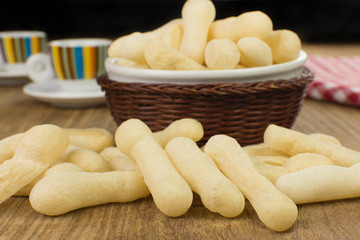 Traditional Brazilian starch biscuit called biscoito de polvilho in a wood background coffe table