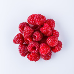 Juicy fresh natural raspberries on white acrylic background