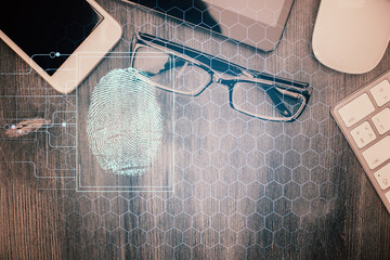 Double exposure of finger print over table with phone. Top view. Concept of mobile security.