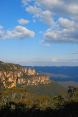 Fototapeta na wymiar The Three Sisters are an unusual rock formation in the Blue Mountains of New South Wales, Australia, on the north escarpment of the Jamison Valley. 