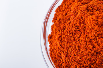 fragrant ground paprika on a white acrylic background