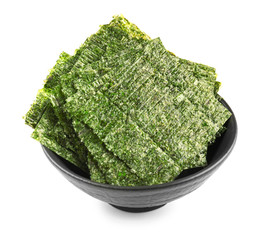 Tasty seaweed sheets in bowl on white background © Pixel-Shot