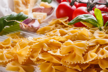 concept of traditional italian pasta with tomatoes and basil