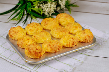 Cooked brazilian cheese bread chipa in baking pan.