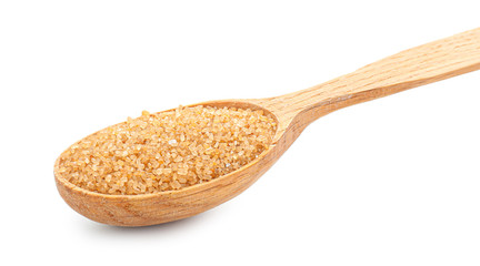 Spoon with sweet sugar on white background