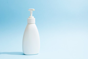 White plastic bottle with dispenser. Sanitizer, liquid soap, shampoo or shower gel mockup