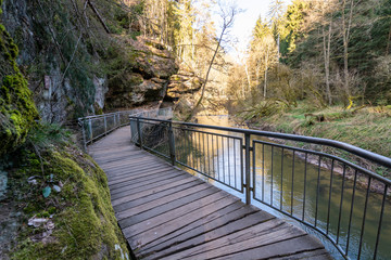 Wooden planks as a path with metal railings in the ravine Schwarzachklamm