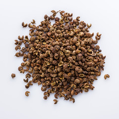 fragrant Sichuan pepper on white acrylic background