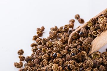 fragrant Sichuan pepper on white acrylic background