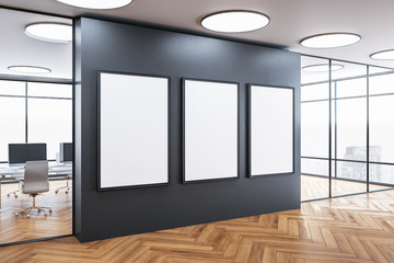 Modern meeting room interior with three blank poster