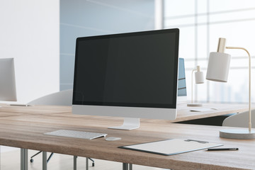 Modern desktop with empty personal computer screen.