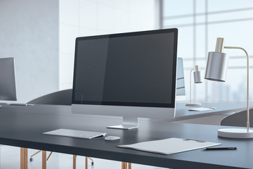 Desktop with blank personal computer screen.
