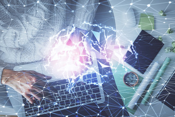Double exposure of woman working on computer andhuman brain hologram drawing. Top View. Ai concept.