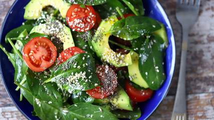 Healthy salad with avocado, spinach and cherry tomatoes. Vegan Salad. Super food. Healthy diet.