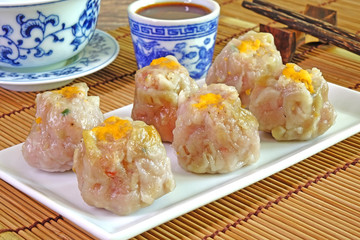 Dim sum : Phuket traditional Fujian style pork dim sum, served with red hot pepper chili sauce and Chinese tea.Famous delicious Thai-Chinese cuisine in Phuket Thailand
