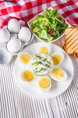boiled chicken eggs on a white wooden rustic background
