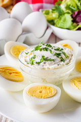 boiled chicken eggs on a white wooden rustic background
