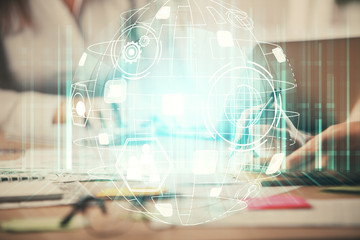 Double exposure of woman hands typing on computer and social network theme hologram drawing. People...