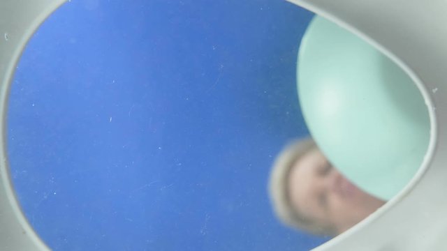 woman throws food in the toilet. the view from the toilet.