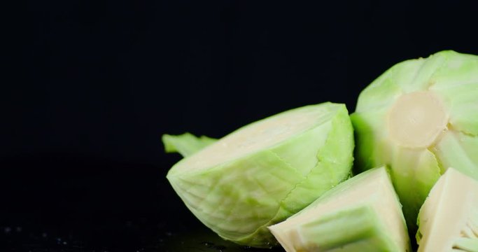 Pieces of fresh cabbage slowly rotate.