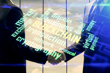 Double exposure of blockchain hologram and handshake of two men. Crypto business concept.