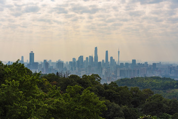 Taking photos of Guangzhou downtown at the top of Baiyun Mountain