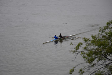 Two rowing kayaks sail across the Danube