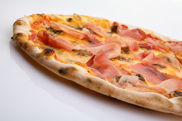 Flatlay of Italian pizza on white background. Rustic homemade pizzas with salami, bacon,  cheese, eggs and raw vegetables on shabby wooden background. Healthy vegetarian fungi pizza