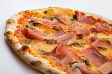 Flatlay of Italian pizza on white background. Rustic homemade pizzas with salami, bacon,  cheese, eggs and raw vegetables on shabby wooden background. Healthy vegetarian fungi pizza