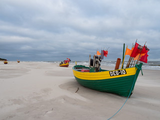 Debki beach, colorful fishing boats at the seashore. Poland