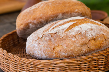 fresh baked bread rustic closeup. Wicker basket background bakery